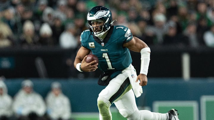 Nov 14, 2024; Philadelphia, Pennsylvania, USA; against the Washington CommandersPhiladelphia Eagles quarterback Jalen Hurts (1) runs with he ball during the fourth quarter at Lincoln Financial Field. Mandatory Credit: Bill Streicher-Imagn Images