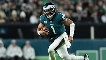 Nov 14, 2024; Philadelphia, Pennsylvania, USA; against the Washington CommandersPhiladelphia Eagles quarterback Jalen Hurts (1) runs with he ball during the fourth quarter at Lincoln Financial Field. Mandatory Credit: Bill Streicher-Imagn Images