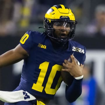 Jan 8, 2024; Houston, TX, USA; Michigan Wolverines quarterback Alex Orji (10) against the Washington Huskies during the 2024 College Football Playoff national championship game at NRG Stadium. Mandatory Credit: Mark J. Rebilas-USA TODAY Sports