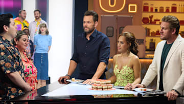 CRIME SCENE KITCHEN: L-R: Contestants Daniel and Becky with host Joel McHale and judges Yolanda Gampp and Curtis Stone