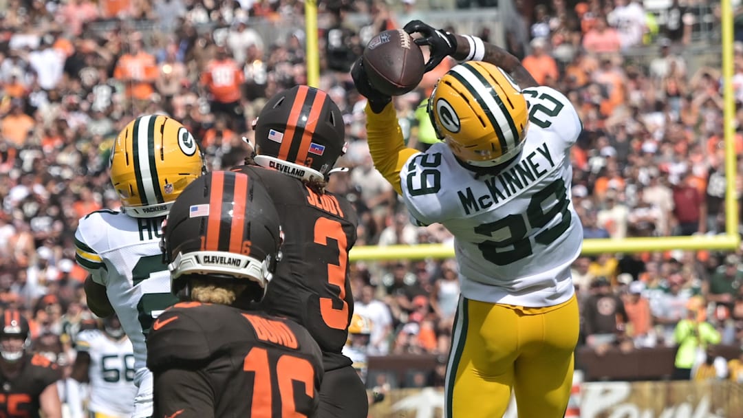 Green Bay Packers safety Xavier McKinney (29) intercepts a pass against the Cleveland Browns