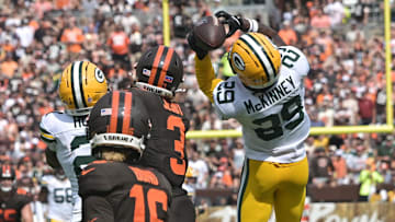 Green Bay Packers safety Xavier McKinney (29) intercepts a pass against the Cleveland Browns