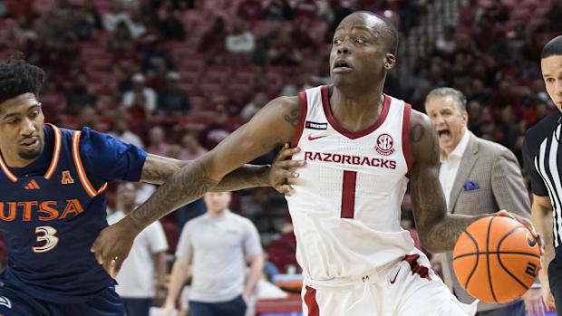 Razorbacks guard Johnell Davis (1) drives around Texas-San Antonio guard Tai'Reon Joseph (3)
