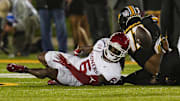 Nov 9, 2024; Columbia, Missouri, USA; Oklahoma Sooners wide receiver Deion Burks (6) fumbles the ball during the second half against the Missouri Tigers at Faurot Field at Memorial Stadium. Mandatory Credit: Jay Biggerstaff-Imagn Images