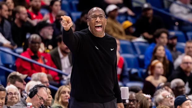 Sacramento Kings head coach Mike Brown gives direction as he stands on the court against the New Orleans Pelicans