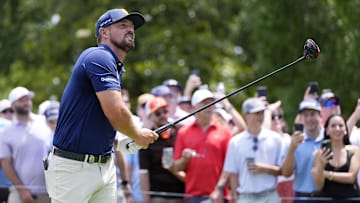 Bryson DeChambeau tees off on the third hole during the final round of the PGA Championship golf tournament at Quail Hollow