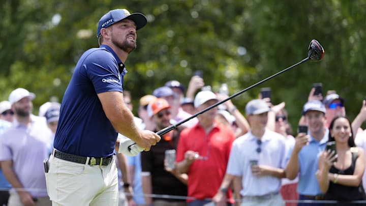 Bryson DeChambeau tees off on the third hole during the final round of the PGA Championship golf tournament at Quail Hollow