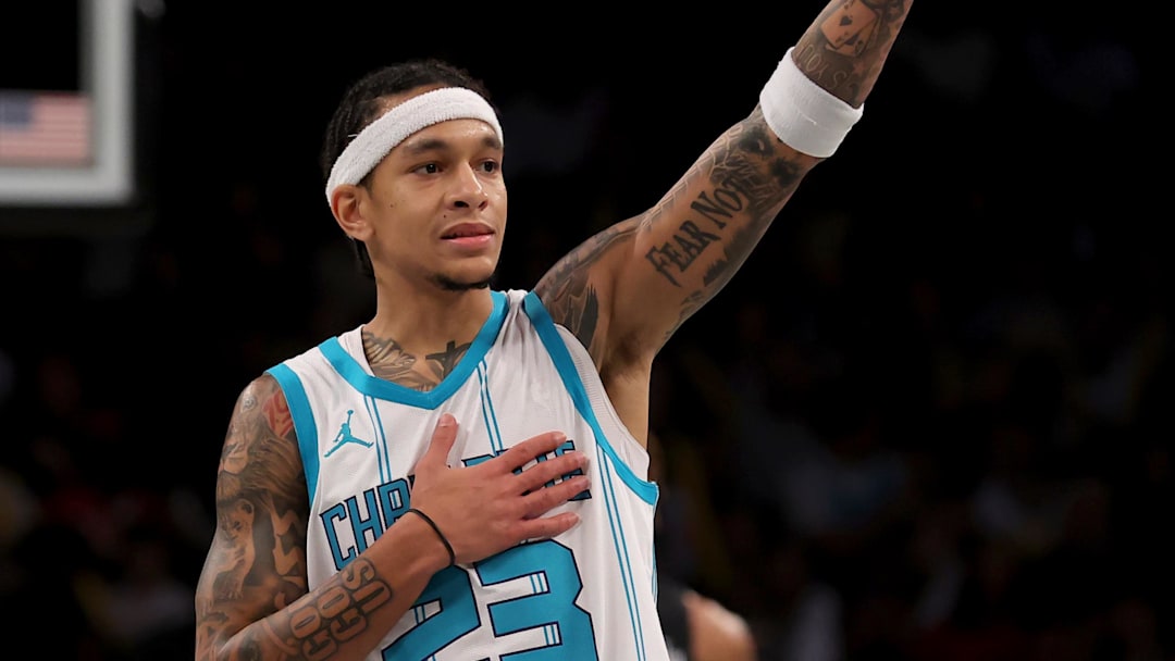 Nov 19, 2024; Brooklyn, New York, USA; Charlotte Hornets guard Tre Mann (23) reacts after receiving a technical foul during the third quarter against the Brooklyn Nets at Barclays Center. Mandatory Credit: Brad Penner-Imagn Images