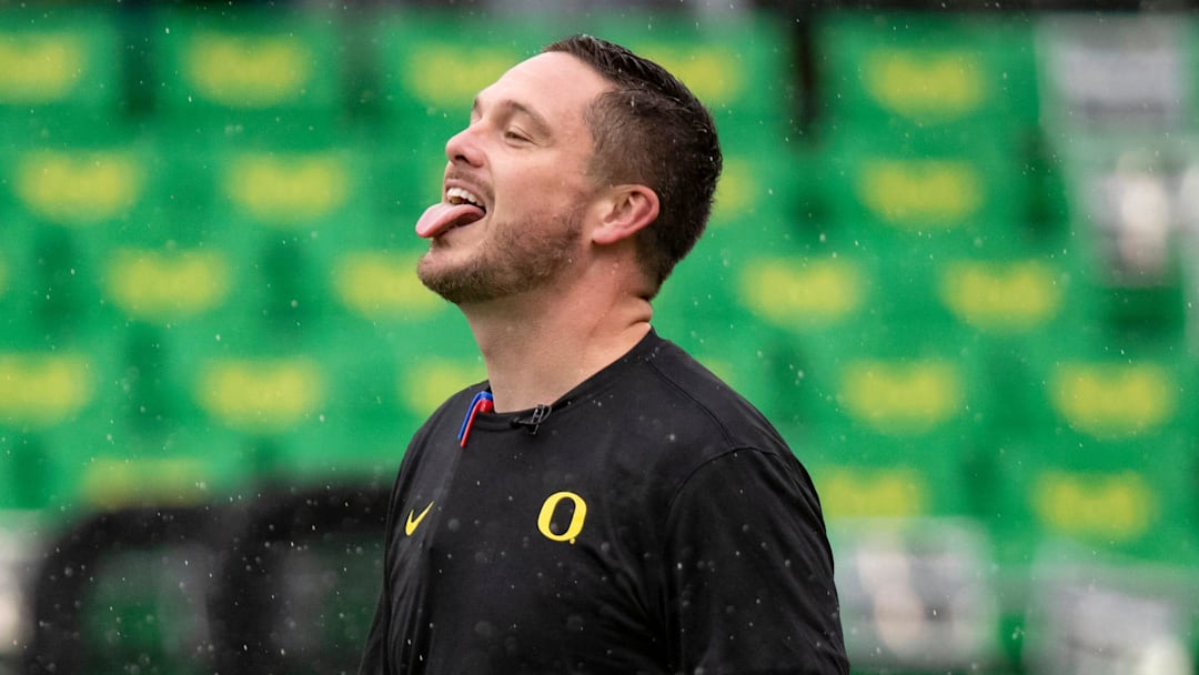 Oregon head coach Dan Lanning sticks his tongue out to catch the rain as the No. 6 Oregon Ducks host California Saturday, Nov. 4, 2023, at Autzen Stadium in Eugene, Ore.