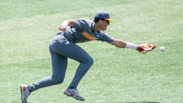 Tennessee's Dean Curley (23) can't field the ball during game two of the NCAA baseball tournament Knoxville Super Regional between Tennessee and Evansville held at Lindsey Nelson Stadium on Saturday, June 8, 2024.