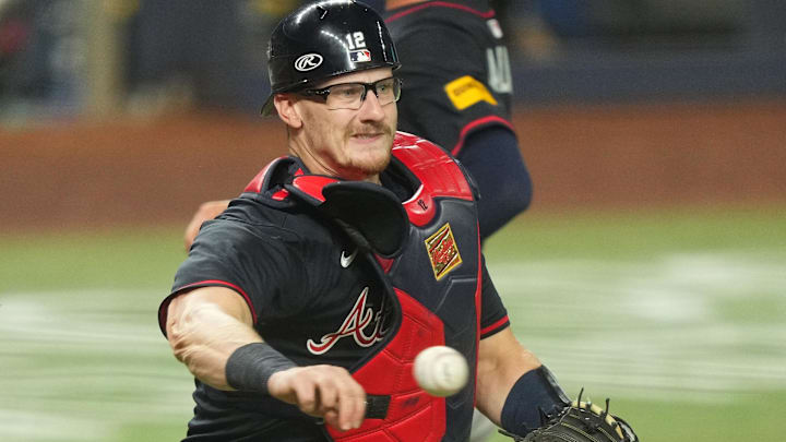 Atlanta Braves catcher Sean Murphy (12) throws out Miami Marlins right fielder Jakob Marsee (87) in the fifth inning at loanDepot Park.