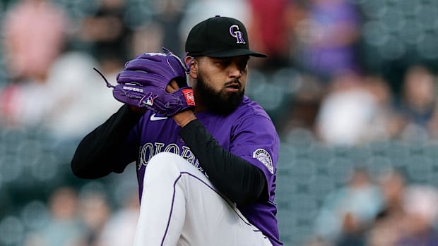 Colorado Rockies pitcher German Marquez throws off the mound wearing a purple uniform.