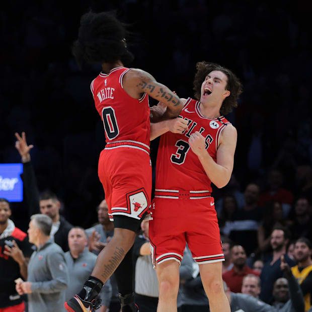 Chicago Bulls guard Josh Giddey (3) celebrates with guard Coby White (0) Chicago Bulls guard Josh Giddey (3) celebrates with guard Coby White (0)
