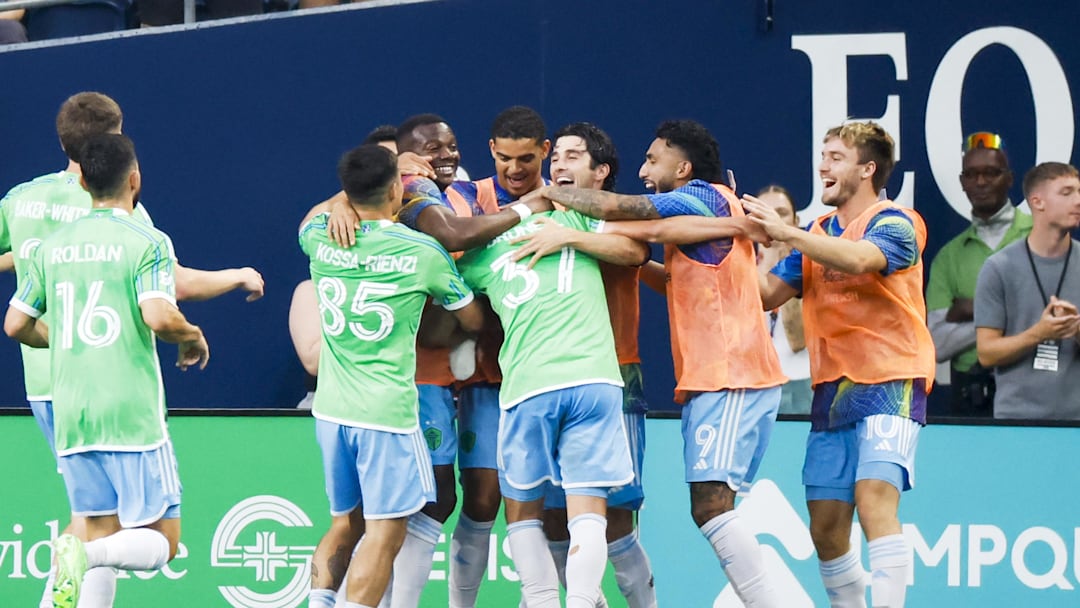 Aug 24, 2025; Seattle, Washington, USA; Seattle Sounders FC midfielder Snyder Brunell (37) celebrates with teammates after scoring a goal against the Sporting Kansas City during the second half at Lumen Field. Mandatory Credit: Joe Nicholson-Imagn Images