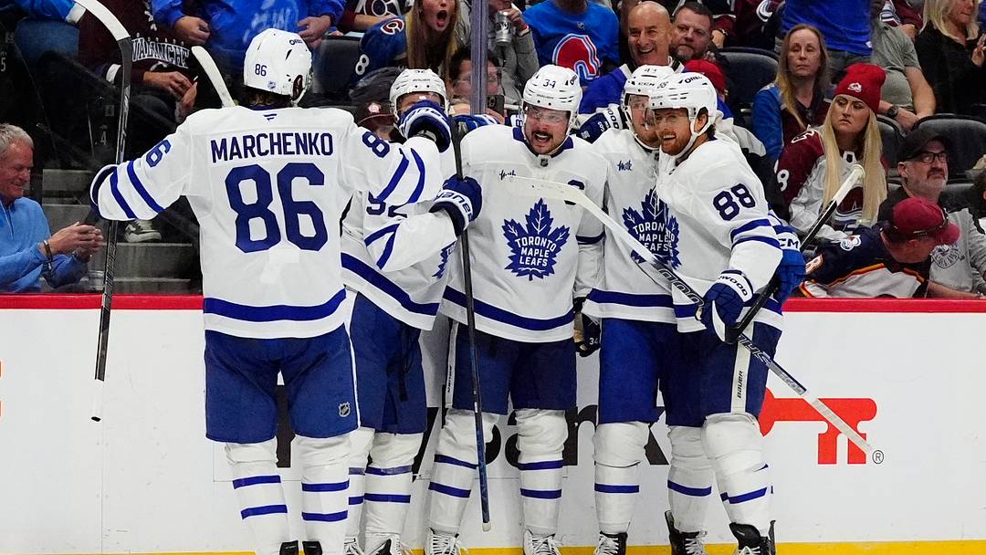 Oct 10, 2026; Denver, Colorado, USA;  Members of the Toronto Maple Leafs celebrate a goal scored in the third period against the Toronto Maple Leafs at Ball Arena.  Mandatory Credit: Ron Chenoy-Imagn Images