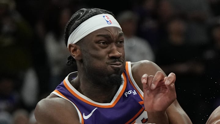 Feb 7, 2026; Phoenix, Arizona, USA; Philadelphia 76ers center Joel Embiid (21) battles for position against Phoenix Suns center Mark Williams (15) and forward Dillon Brooks (3) during the second half of an NBA game at Mortgage Matchup Center. Mandatory Credit: Rick Scuteri-Imagn Images