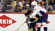 May 7, 2018; Pittsburgh, PA, USA; Pittsburgh Penguins center Evgeni Malkin (71) moves the puck against pressure from Washington Capitals left wing Alex Ovechkin (8) during the second period in game six of the second round of the 2018 Stanley Cup Playoffs at PPG PAINTS Arena. The Capitals won 2-1 in overtime to win the series 4 games to 2. Mandatory Credit: Charles LeClaire-Imagn Images