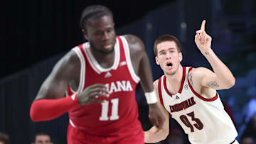 Louisville Cardinals forward Noah Waterman (93) reacts after scoring in front of Indiana Hoosiers center Oumar Ballo (11).