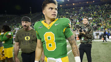 Nov 9, 2024; Eugene, Oregon, USA; Oregon Ducks quarterback Dillon Gabriel (8) walks off the field after a game against the Maryland Terrapins at Autzen Stadium. Mandatory Credit: Troy Wayrynen-Imagn Images