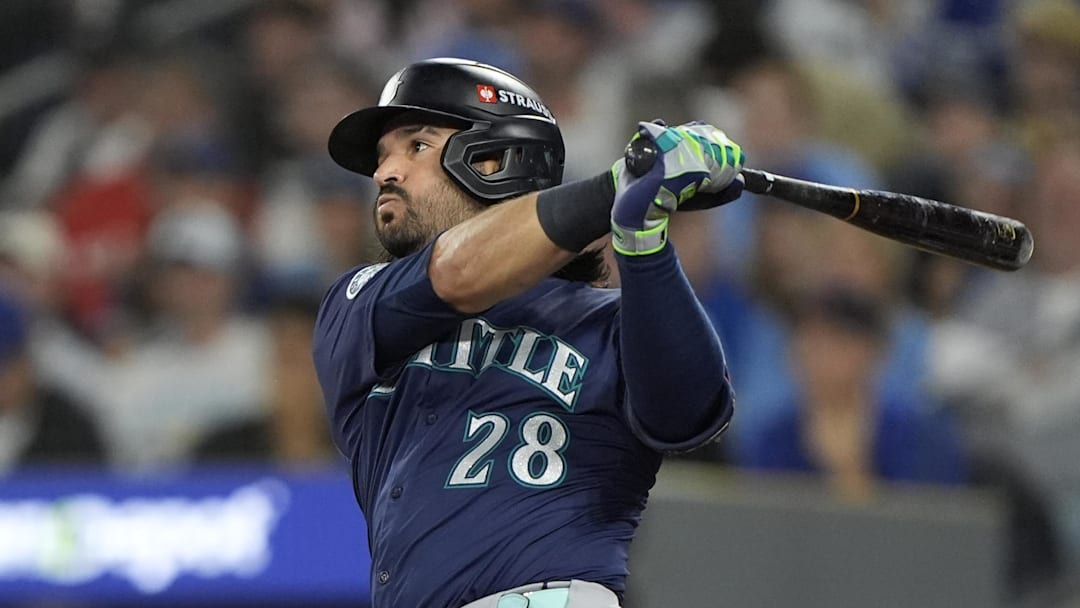 Oct 20, 2025; Toronto, Ontario, CAN; Seattle Mariners third baseman Eugenio Suarez (28) hits a single against the Toronto Blue Jays in the second inning during game seven of the ALCS round for the 2025 MLB playoffs at Rogers Centre.  Mandatory Credit: John E. Sokolowski-Imagn Images