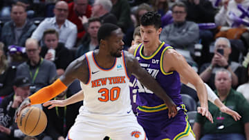 Dec 13, 2023; Salt Lake City, Utah, USA; New York Knicks forward Julius Randle (30) posts up against Utah Jazz forward Simone Fontecchio (16) during the third quarter at Delta Center. Mandatory Credit: Rob Gray-Imagn Images