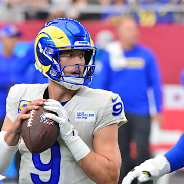 Sep 15, 2024; Glendale, Arizona, USA;  Los Angeles Rams quarterback Matthew Stafford (9) looks to pass in the first half against the Arizona Cardinals at State Farm Stadium. Mandatory Credit: Matt Kartozian-Imagn Images