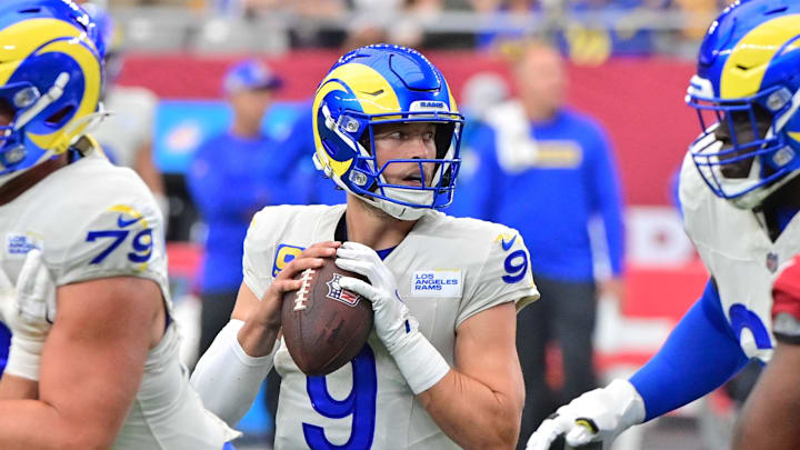 Sep 15, 2024; Glendale, Arizona, USA;  Los Angeles Rams quarterback Matthew Stafford (9) looks to pass in the first half against the Arizona Cardinals at State Farm Stadium. Mandatory Credit: Matt Kartozian-Imagn Images