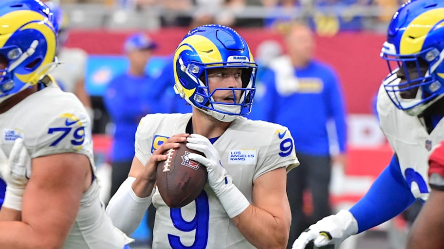 Sep 15, 2024; Glendale, Arizona, USA;  Los Angeles Rams quarterback Matthew Stafford (9) looks to pass in the first half against the Arizona Cardinals at State Farm Stadium. Mandatory Credit: Matt Kartozian-Imagn Images | Matt Kartozian-Imagn Images