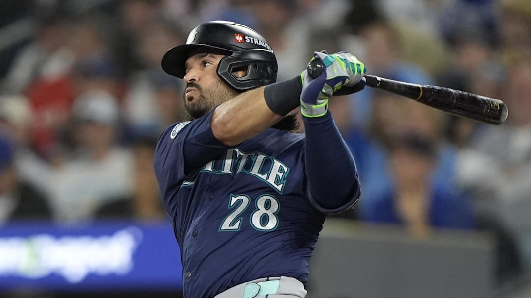 Oct 20, 2025; Toronto, Ontario, CAN; Seattle Mariners third baseman Eugenio Suarez (28) hits a single against the Toronto Blue Jays in the second inning during game seven of the ALCS round for the 2025 MLB playoffs at Rogers Centre.  Mandatory Credit: John E. Sokolowski-Imagn Images