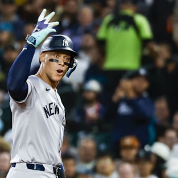 Sep 17, 2024; Seattle, Washington, USA; New York Yankees designated hitter Aaron Judge (99) reacts towards the Yankee dugout after hitting a two-run single against the Seattle Mariners during the second inning at T-Mobile Park.