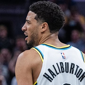 Mar 11, 2025; Indianapolis, Indiana, USA;Indiana Pacers guard Tyrese Haliburton (0) celebrates his made basket and foul  in the second half against the Milwaukee Bucks  at Gainbridge Fieldhouse. Mandatory Credit: Trevor Ruszkowski-Imagn Images