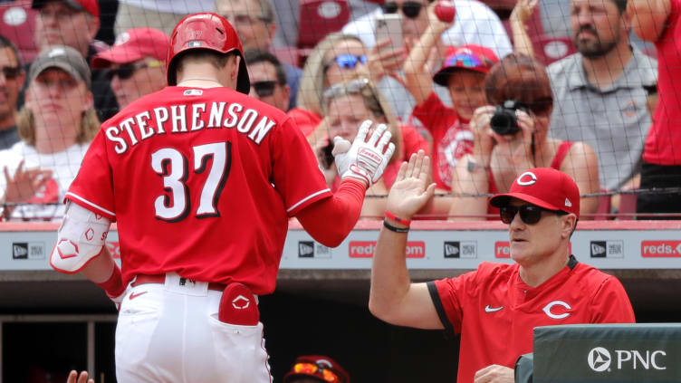 Cincinnati Reds catcher Tyler Stephenson (37) reacts with manager David Bell.