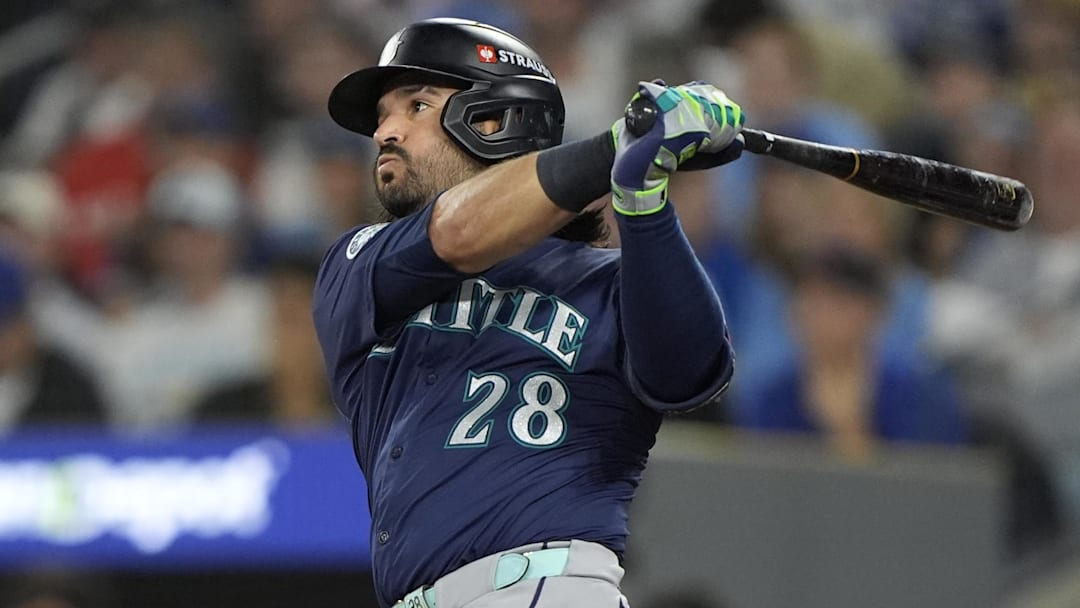 Oct 20, 2025; Toronto, Ontario, CAN; Seattle Mariners third baseman Eugenio Suarez (28) hits a single against the Toronto Blue Jays in the second inning during game seven of the ALCS round for the 2025 MLB playoffs at Rogers Centre.  Mandatory Credit: John E. Sokolowski-Imagn Images