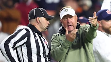 Nov 23, 2024; Auburn, Alabama, USA;  Auburn Tigers head coach Hugh Freeze speaks with a game official during the second quarter against the Texas A&M Aggies at Jordan-Hare Stadium. Mandatory Credit: John Reed-Imagn Images