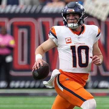 Nov 2, 2025; Houston, Texas, USA; Denver Broncos quarterback Bo Nix (10) scrambles during the second half against the Houston Texans at NRG Stadium. 