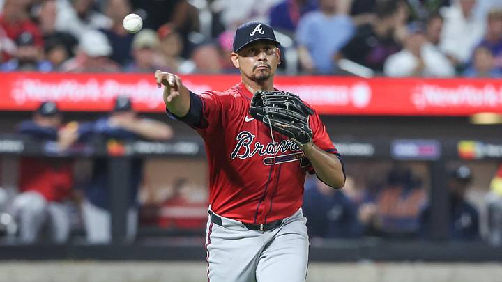 Aug 13, 2025; New York City, New York, USA;  Atlanta Braves starting pitcher Carlos Carrasco (59) throws a runner out at first base in the second inning against the New York Mets at Citi Field. Mandatory Credit: Wendell Cruz-Imagn Images