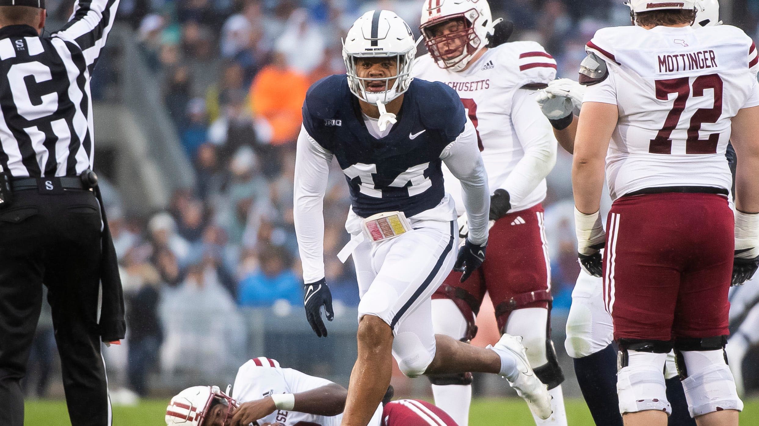 Penn State defensive end Chop Robinson reacts after sacking the Massachusetts quarterback.