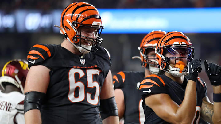 Sep 23, 2024; Cincinnati, Ohio, USA; Cincinnati Bengals wide receiver Andrei Iosivas (80) celebrates a touchdown with guard Alex Cappa (65) and guard Cordell Volson (67) during the third quarter against the Washington Commanders at Paycor Stadium. Mandatory Credit: Joseph Maiorana-Imagn Images