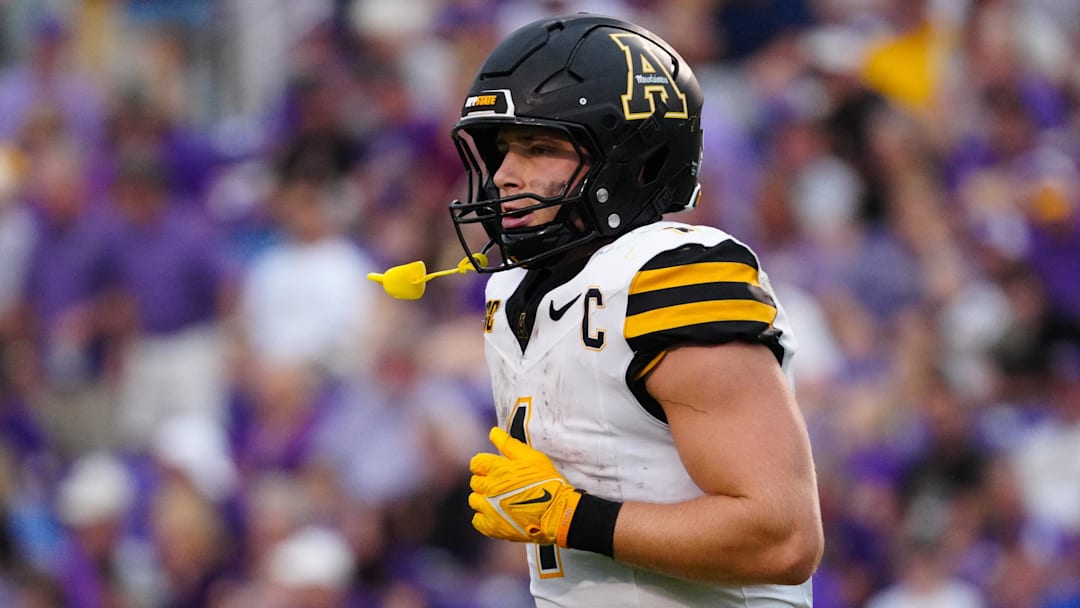 Sep 14, 2024; Greenville, North Carolina, USA;  Appalachian State Mountaineers quarterback Joey Aguilar (4) runs off the field against the East Carolina Pirates during the second half at Dowdy-Ficklen Stadium. Mandatory Credit: James Guillory-Imagn Images