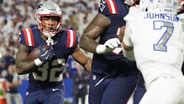 Oct 5, 2025; Orchard Park, New York, USA; New England Patriots running back Treveyon Henderson (32) rushes the ball against the Buffalo Bills during the first half at Highmark Stadium.
