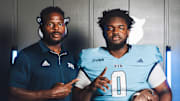 FIU defensive line coach Kenechi Udeze and transfer L'Cier Luter on his official visit