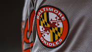 May 5, 2024; Cincinnati, Ohio, USA; The Baltimore Orioles logo on the sleeve of designated hitter Gunnar Henderson (2) as he prepares on deck during the seventh inning against the Cincinnati Reds at Great American Ball Park. Mandatory Credit: Katie Stratman-Imagn Images