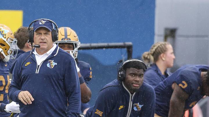 Sep 27, 2025; Morgantown, West Virginia, USA; West Virginia Mountaineers head coach Rich Rodriguez watches a play during the first quarter against the Utah Utes at Milan Puskar Stadium. Mandatory Credit: Ben Queen-Imagn Images