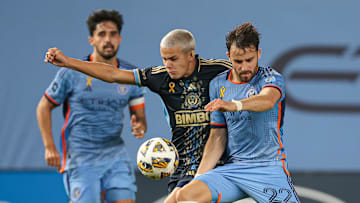 Sep 18, 2024; Bronx, New York, USA;  New York City FC forward Kevin O'Toole (22) battle for the ball against Philadelphia Union midfielder Cavan Sullivan (6) during the second half at Yankee Stadium. Mandatory Credit: Vincent Carchietta-Imagn Images