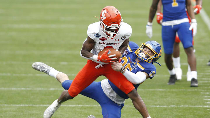 Sam Houston State Bearkats wide receiver Ife Adeyi (2) catches a pass against  South Dakota State Jackrabbits safety Chase Norblade (35) during the Division I FCS Championship football game at Toyota Stadium. 