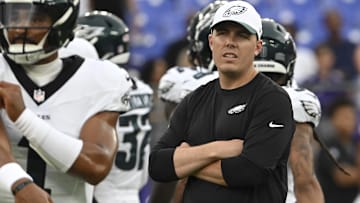 Former Philadelphia Eagles offensive coordinator Kellen Moore looks on as quarterback Jalen Hurts (1) throws before a preseason game against the Baltimore Ravens at M&T Bank Stadium.