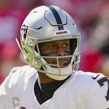 Oct 19, 2025; Kansas City, Missouri, USA; Las Vegas Raiders quarterback Geno Smith (7) drops back to pass during the second half against the Kansas City Chiefs at GEHA Field at Arrowhead Stadium. Mandatory Credit: Jay Biggerstaff-Imagn Images