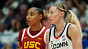 Dec 21, 2024; Hartford, Connecticut, USA; UConn Huskies guard Paige Bueckers (5) and USC Trojans guard JuJu Watkins (12) on the court in the first half at XL Center. Mandatory Credit: David Butler II-Imagn Images