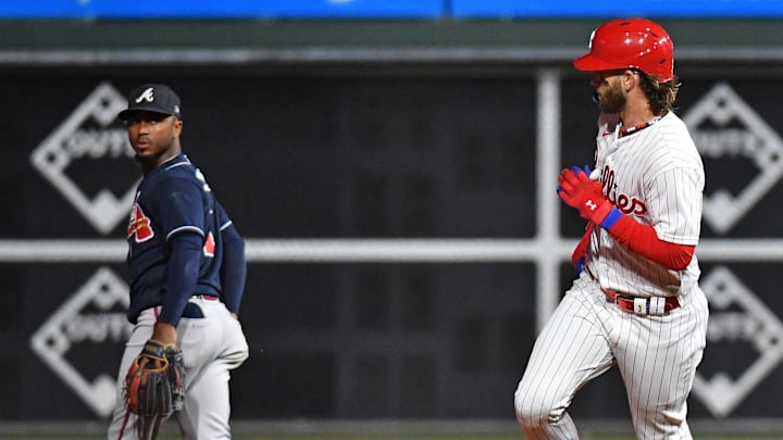 Oct 11, 2023; Philadelphia, Pennsylvania, USA;  Philadelphia Phillies first baseman Bryce Harper (3) hits a solo home run during the fifth inning against the Atlanta Braves in game three of the NLDS for the 2023 MLB playoffs at Citizens Bank Park.