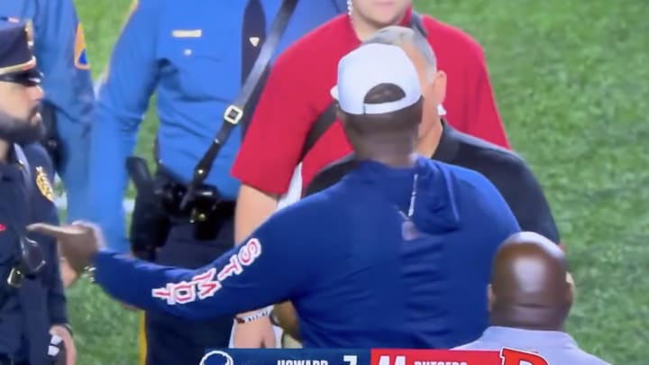 Coaches Larry Scott and Greg Schiano have words after a late touchdown.